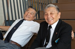 Having worked a lifetime in Judo, brothers Jimmy and Edwin Takemori take a break on the bleachers.