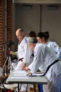 Getting judging and scoring in order. Tournament director Terence McPartland and Shufu Kata Chair Diane Jackson
