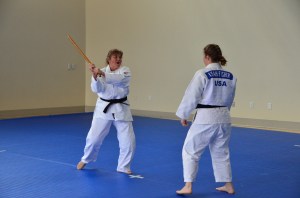 She's coming at me with a stick!