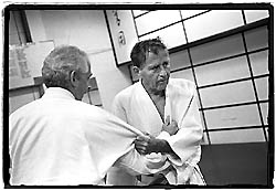 John Anderson demonstrates a hold technique on fellow blackbelt Charles Peters